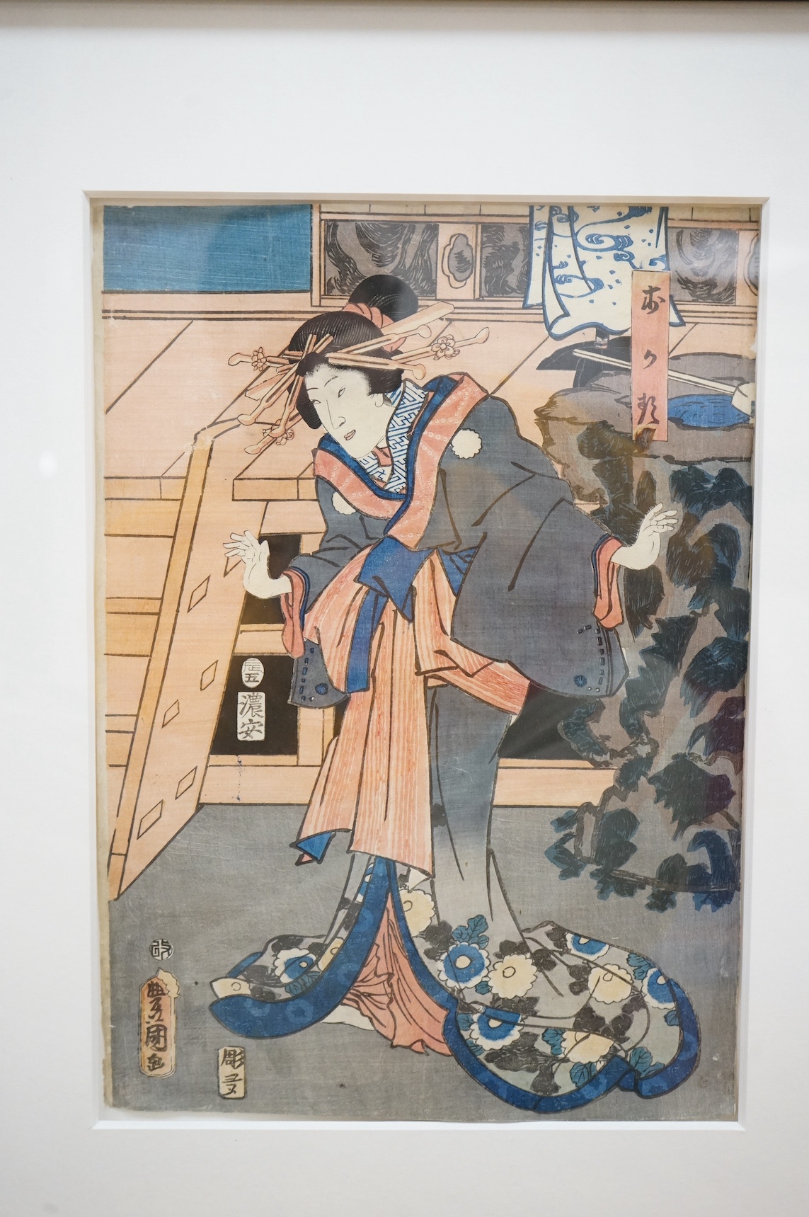 Four Japanese woodblock prints, to include: after Toyokuni - kabuki actors together with a Chinese printed booklet, largest 35 x 23cm. Condition - good